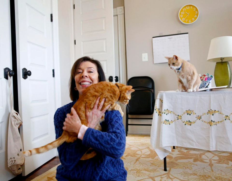 Susan Micari is shown with her cats, Rubilee and Loki, at her home in Richmond on Monday. Last fall, as a volunteer and via Zoom, Micari taught English, primarily to Afghan girls living in a safe house in Kabul.
